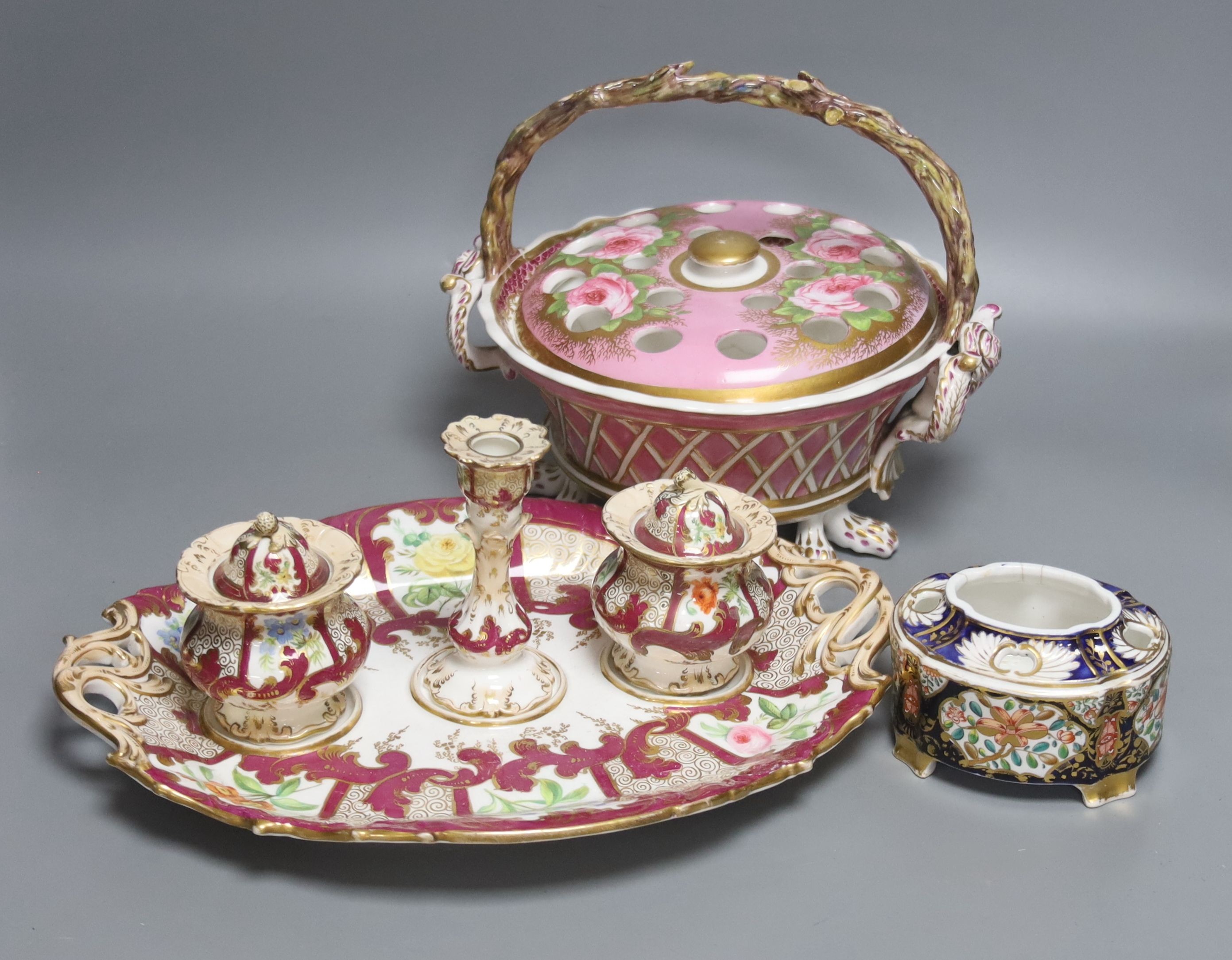 A 19th century English porcelain inkstand, a basket and associated cover and a Spode base, tallest 20cm